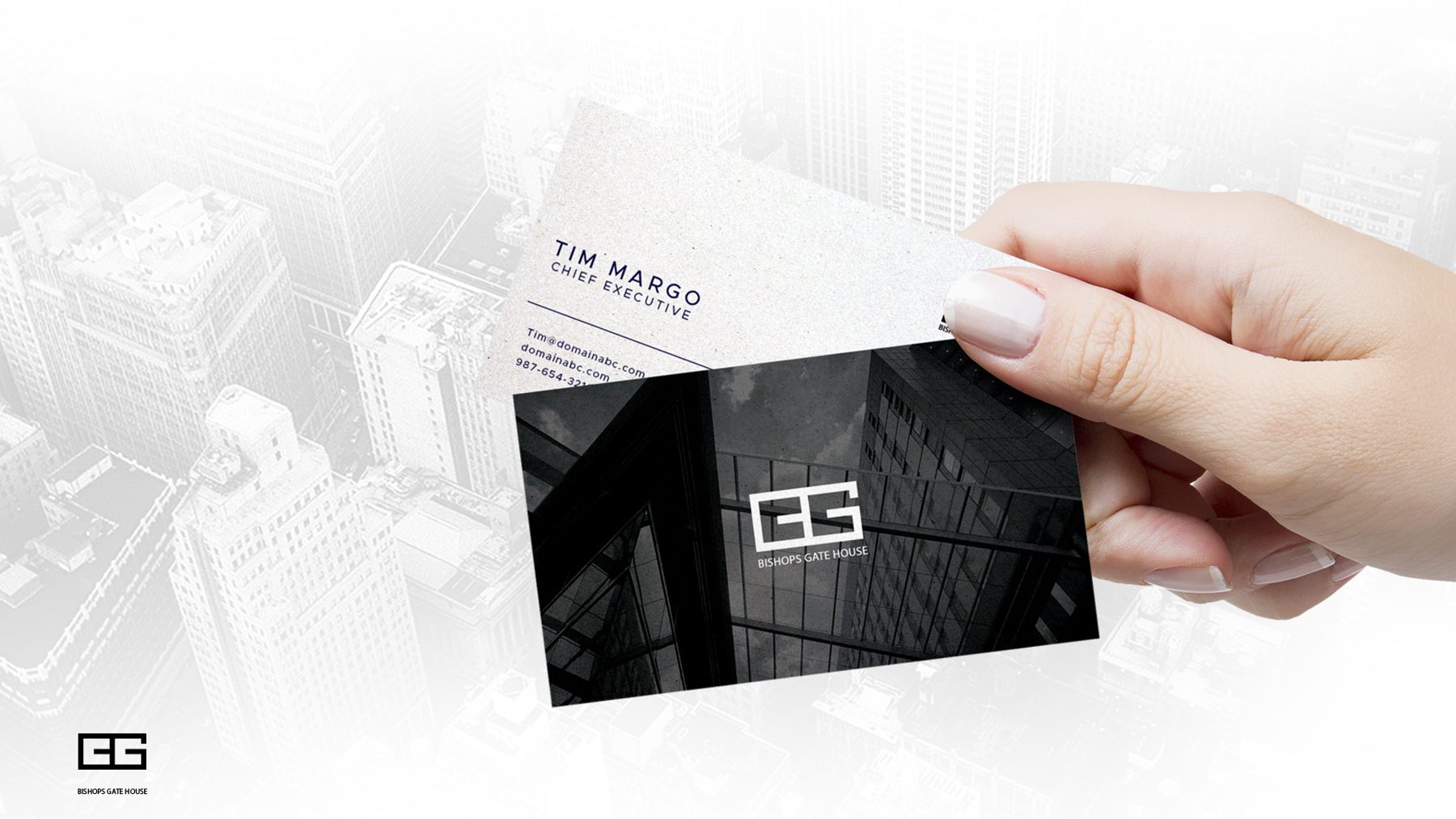 Hand holding a black Bishopsgate House business card